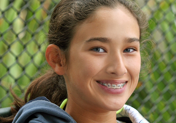 Teenage girl smiling with braces